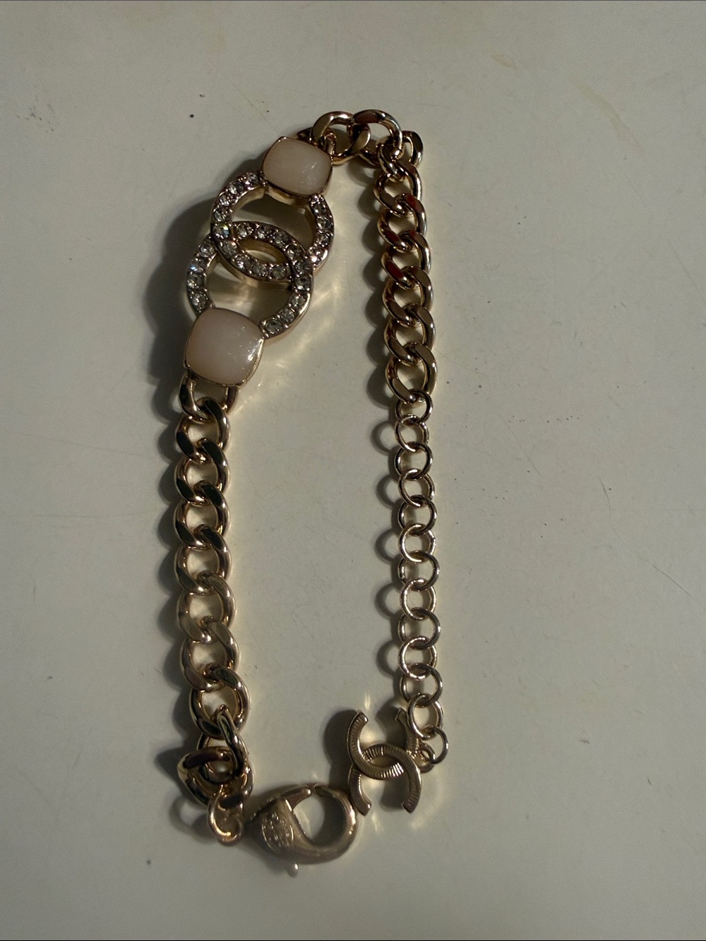Gold-Tone Chain Bracelet with Cream Accents and Crystal Links